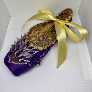 Decorated purple pointe shoe